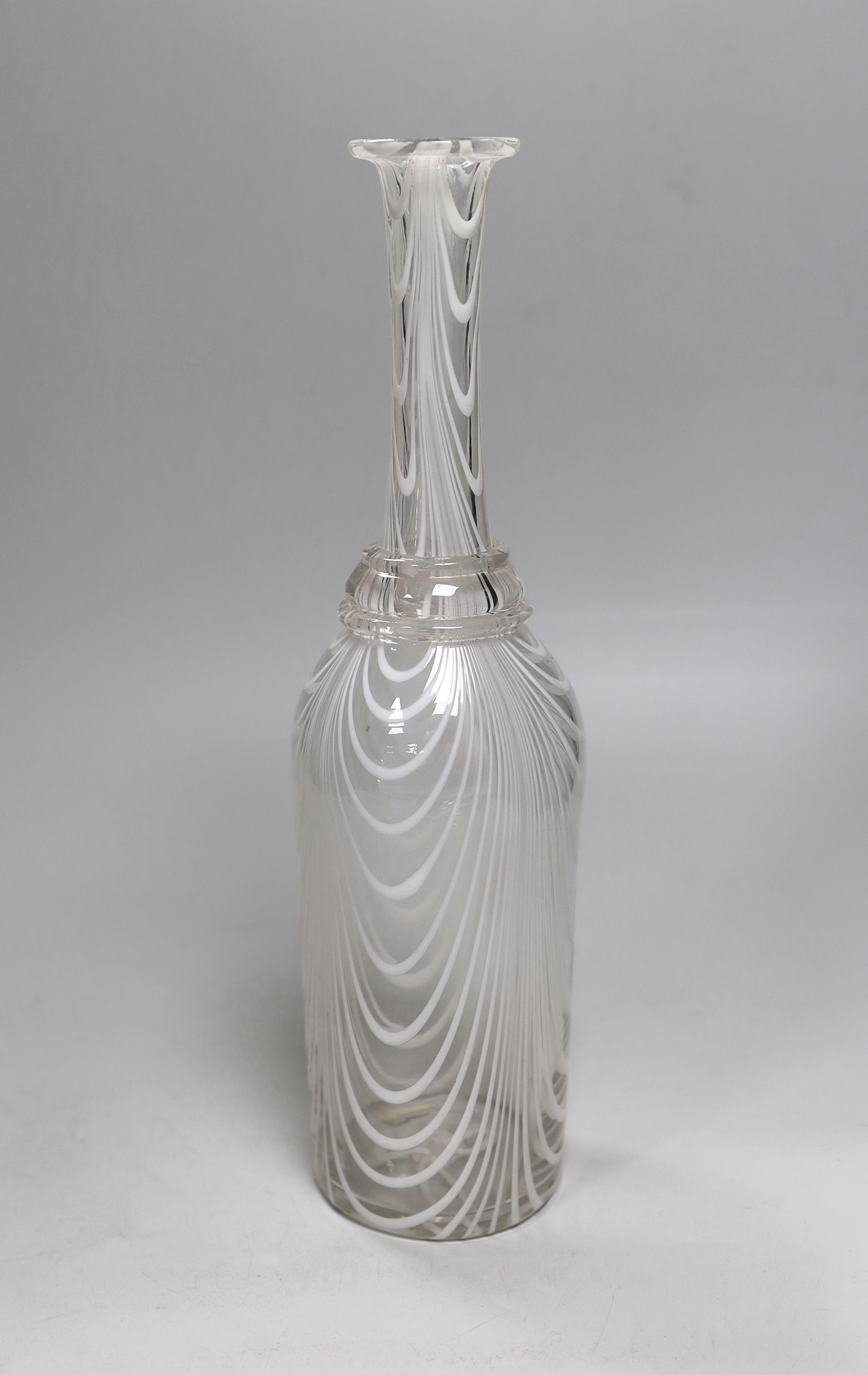 A 19th century Nailsea bottle vase, c1840-50, of long necked form with white combed decoration, three applied neck rings and rough pontil, 33cm high
